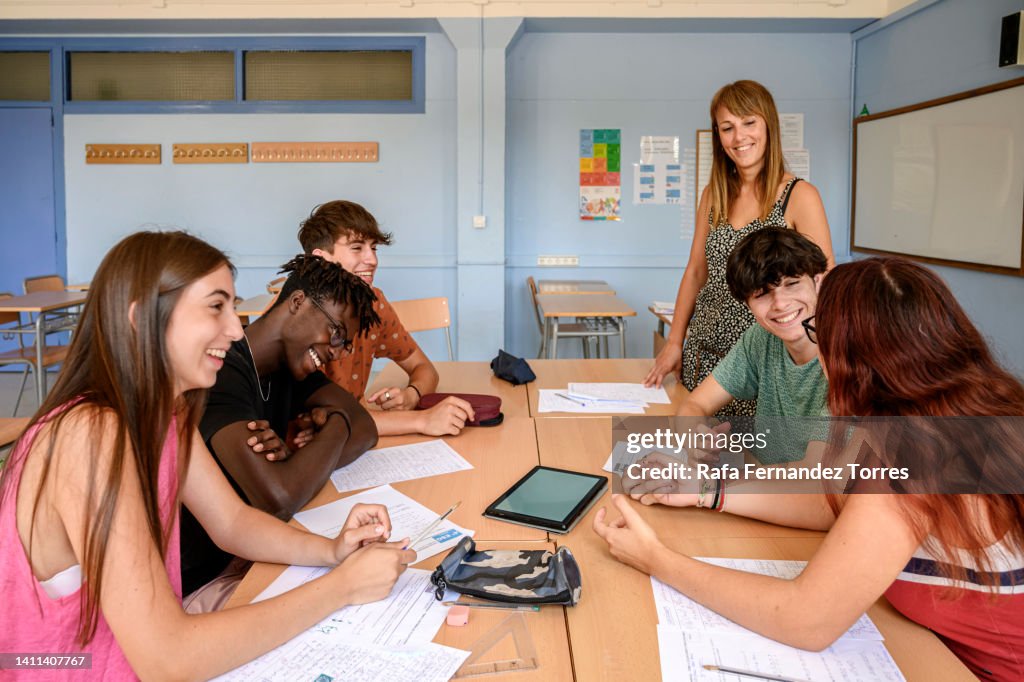 Working In College College Students Working In Group With Technology High-Res Stock Photo ...