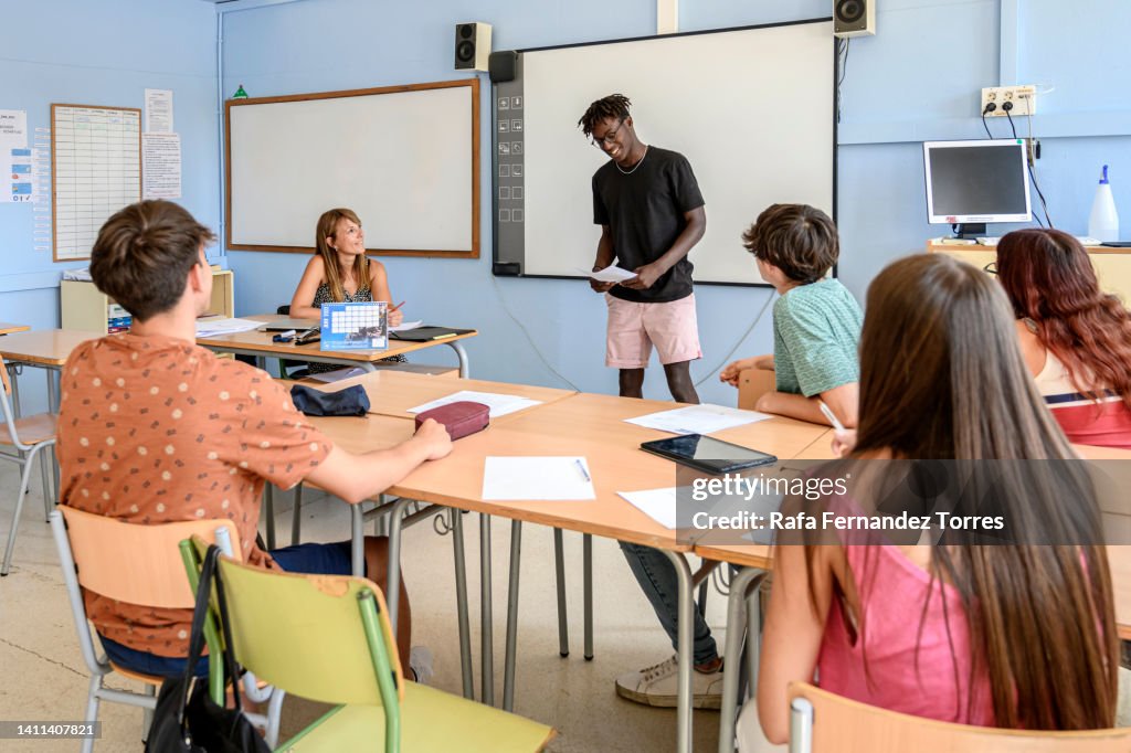 Presentation In Class Black Teen Student Giving Presentation In Front Of Class High-Res Stock ...