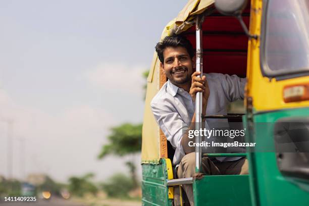 young man travelling in the auto rickshaw - auto riquexó imagens e fotografias de stock