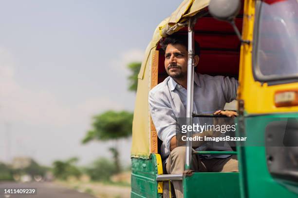 young man travelling in the auto rickshaw - motorriksha bildbanksfoton och bilder
