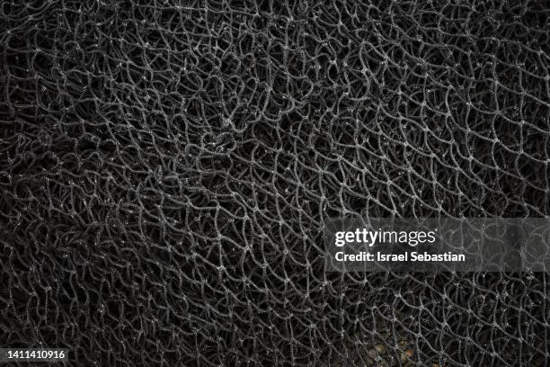 close-up of a used black fishing net - 網 體育設備 個照片及圖片檔