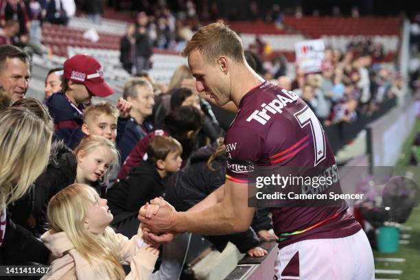 Daly Cherry-Evans of the Sea Eagles greets young fans after the round 20 NRL match between the Manly Sea Eagles and the Sydney Roosters at 4 Pines...