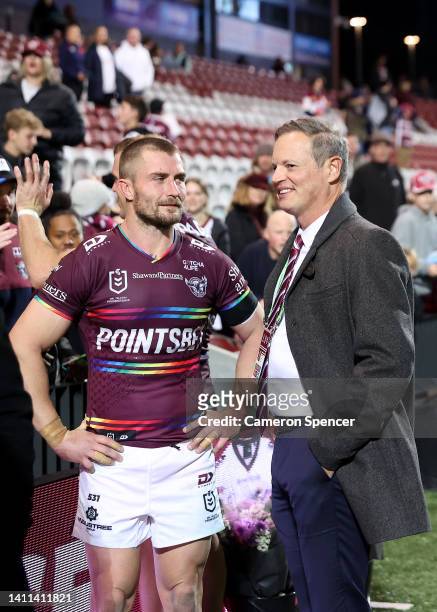 Kieran Foran of the Sea Eagles talks to owner and Chairman of the Manly Warringah Sea Eagles Scott Penn after the round 20 NRL match between the...
