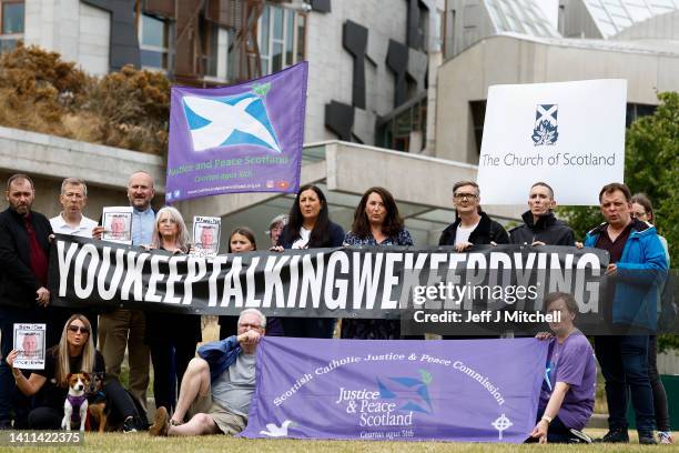 The group Faces And Voices of Recovery hold a protest outside the Scottish Parliament as Scotland’s drugs death figures are published on July 28,...