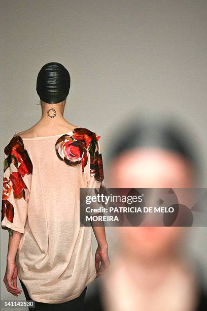 Models display Autum/Winter 2013 creations by Portuguese fashion designer Alexandra Moura during the 38th Edition of Moda Lisboa at Patio da Gale,...