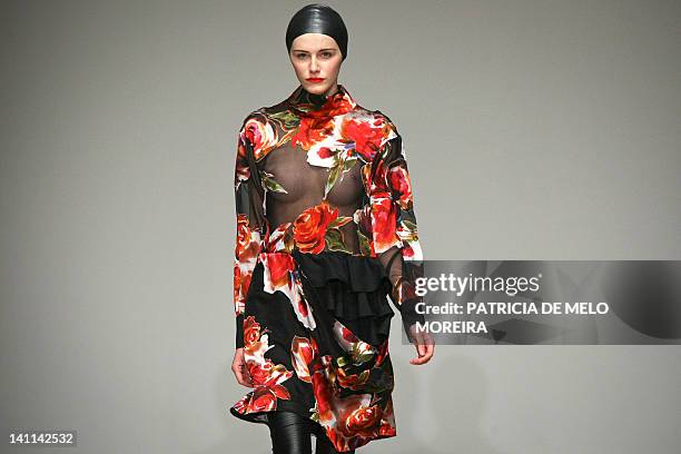 Model displays Autum/Winter 2013 creations by Portuguese fashion designer Alexandra Moura during the 38th Edition of Moda Lisboa at Patio da Gale,...