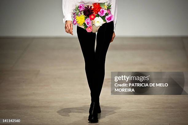 Model displays Autum/Winter 2013 creations by Portuguese fashion designer Alexandra Moura during the 38th Edition of Moda Lisboa at Patio da Gale,...