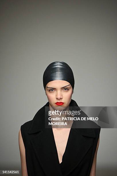 Model displays Autum/Winter 2013 creations by Portuguese fashion designer Alexandra Moura during the 38th Edition of Moda Lisboa at Patio da Gale,...