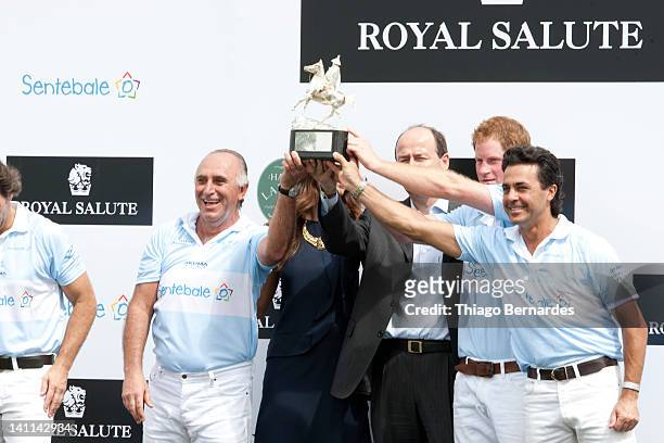 Prince Harry and Fernanda Motta during a premiation Ceremony of the Sentebale Royal Salute Polo Cup 2012 at Haras Larissa on March 11, 2012 in...