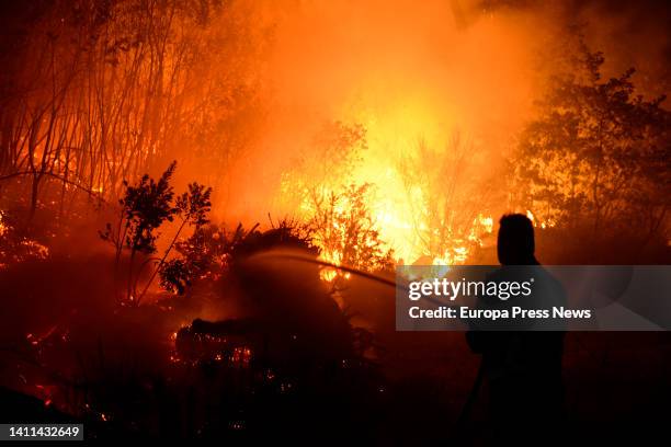 Forestry brigades and neighbors collaborated in controlling the flames, far from homes, on 28 July, 2022 in Cudeiro, Orense, Galicia, Spain....