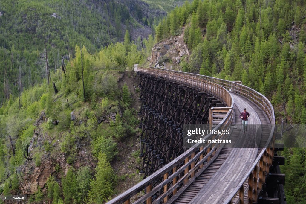 Woman running at the Myra Canyon Trestles near Kelowna