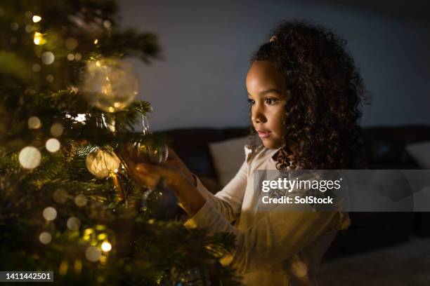 a young girl christmas magic - christmas dark stockfoto's en -beelden