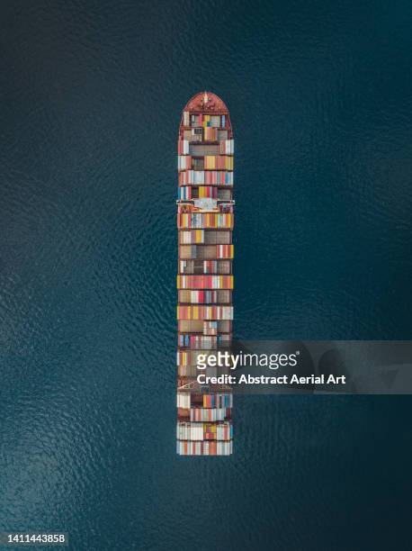 drone image looking down on a cargo container, trieste, italy - triest stock-fotos und bilder