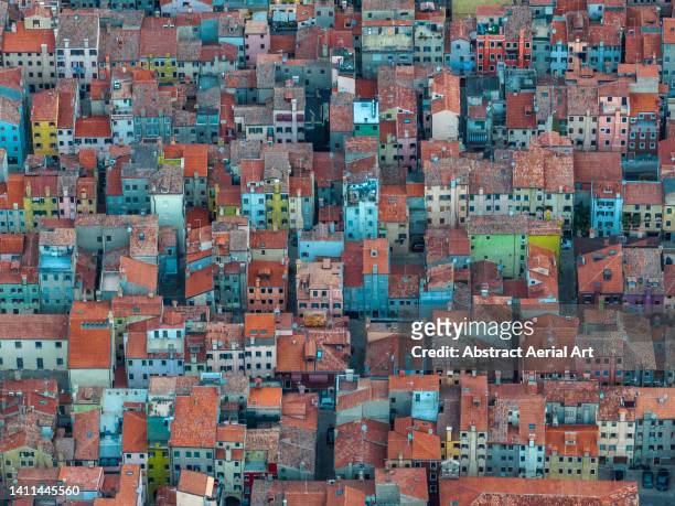 aerial image showing vibrant coloured buildings in chioggia, venice lagoon, italy - esplosione demografica foto e immagini stock
