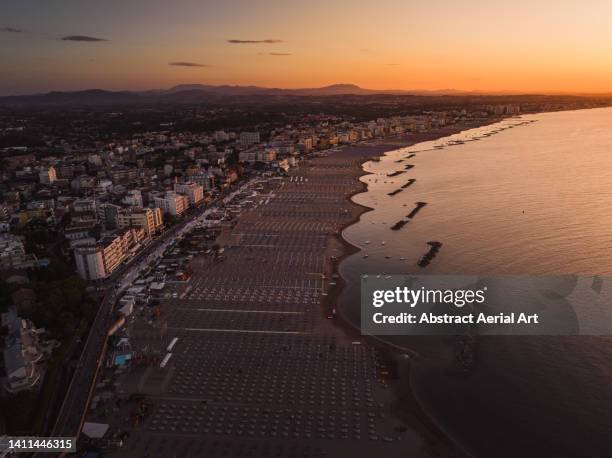 aerial image showing the rimini coastline at sunset, italy - rimini stock pictures, royalty-free photos & images