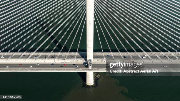 firth of forth road bridge photographed from the side by drone, scotland, united kingdom - south queensferry ストックフォトと画像