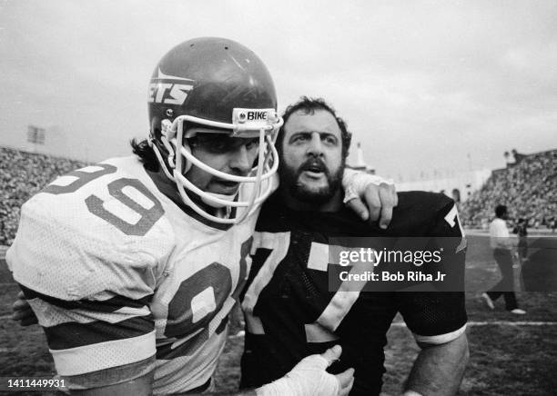 New York Jets Mark Gastineau and Raiders Lyle Alzado congratulate each other after Jets won AFC Playoff game, January 15, 1983 in Los Angeles,...