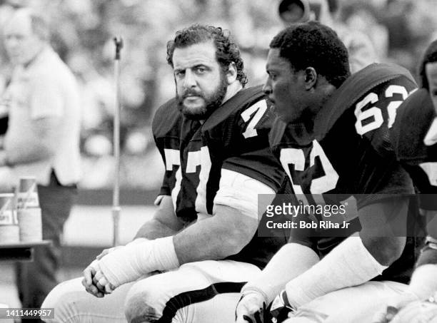 Raiders Lyle Alzado and Reggie Kinlaw take a break during AFC Playoff game, January 15, 1983 in Los Angeles, California.