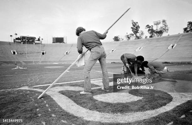 Super Bowl Grounds crew paint the NFL logo and end zones prior to Super Bowl game between Los Angeles Rams and Pittsburgh Steelers, January 18, 1980...