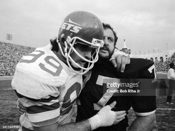 New York Jets Mark Gastineau and Raiders Lyle Alzado congratulate each other after Jets won AFC Playoff game, January 15, 1983 in Los Angeles,...