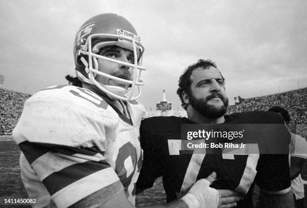 New York Jets Mark Gastineau and Raiders Lyle Alzado congratulate each other after Jets won AFC Playoff game, January 15, 1983 in Los Angeles,...