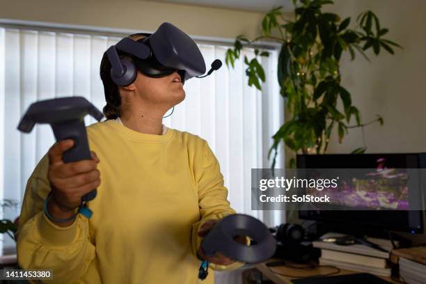 entering the virtual reality world - massively multiplayer online game stock pictures, royalty-free photos & images