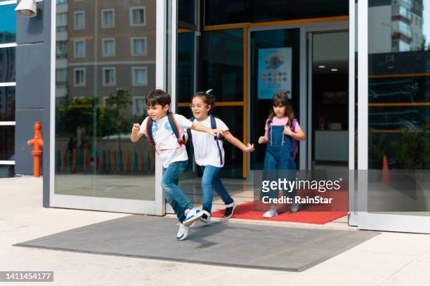 excited students on the last day of school stock - last day of school stock pictures, royalty-free photos & images