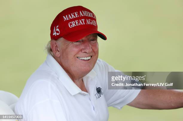 Former U.S. President Donald Trump waits on the ninth tee in his golf cart during the pro-am prior to the LIV Golf Invitational - Bedminster at Trump...