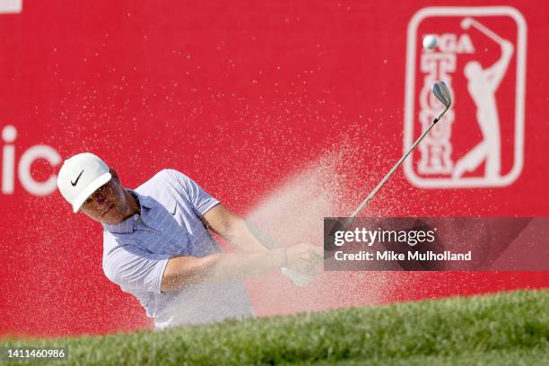 Cameron Champ of the United States plays his shot from the bunker on the 17th hole during the first round of the Rocket Mortgage Classic at Detroit...