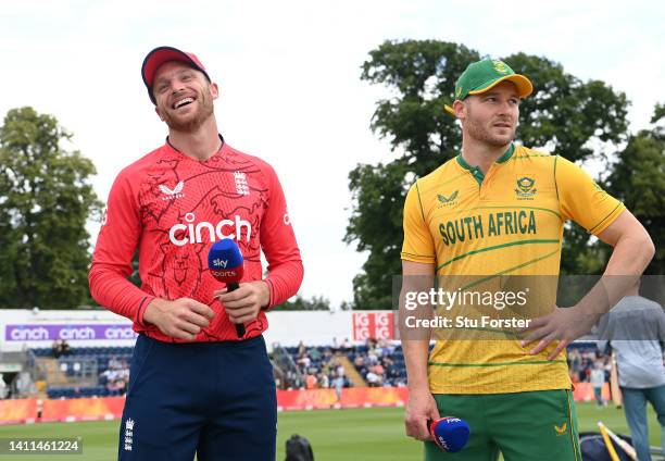 England captain Jos Buttler and South Africa captain David Miller share a joke at the toss during the 2nd Vitality IT20 match between England and...