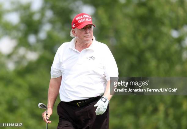 Former U.S. President Donald Trump watches a shot during the pro-am prior to the LIV Golf Invitational - Bedminster at Trump National Golf Club...