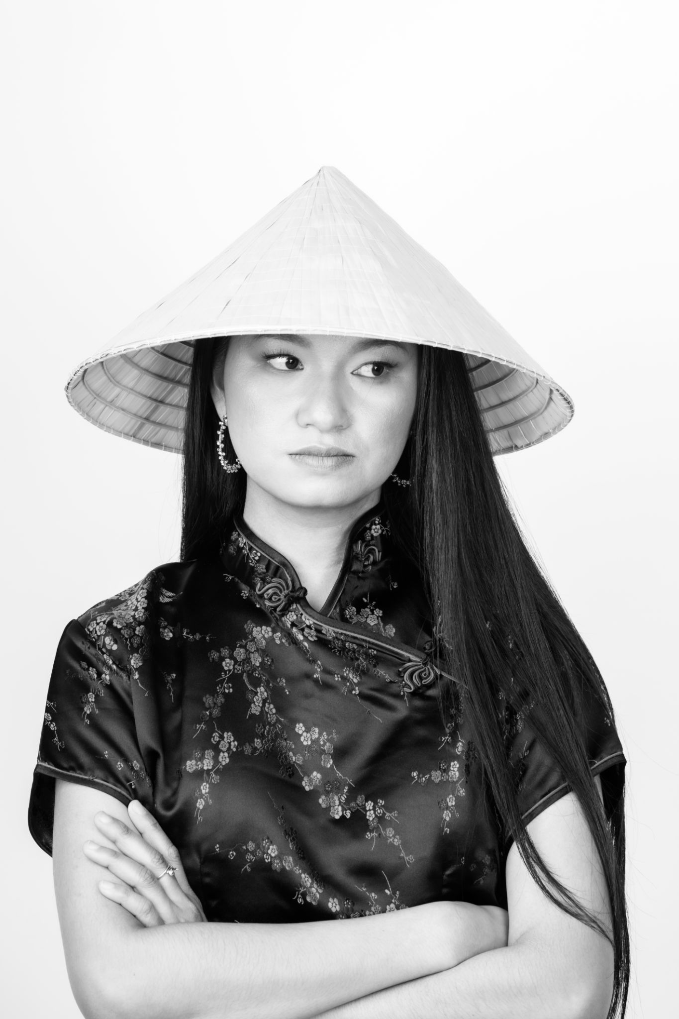 Portrait of Asian woman with cone-shaped Asian cane hat Portrait of Asian woman with cone-shaped Asian cane hat