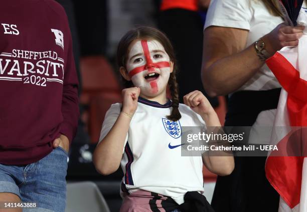 An England fan with a painted face cheers on the team during the UEFA Women's Euro 2022 Semi Final match between England and Sweden at Bramall Lane...