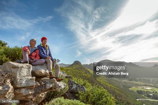 senior couple resting on a mountain hike - cape peninsula stock pictures, royalty-free photos & images