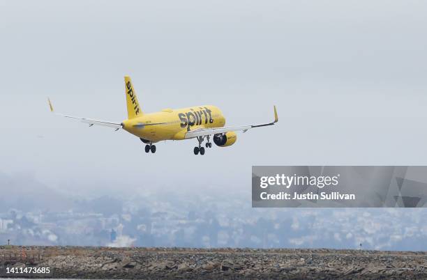 Spirit Airlines plane lands at Oakland International Airport on July 28, 2022 in Oakland, California. JetBlue Airways announced plans to purchase...