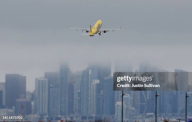 Spirit Airlines plane takes off from Oakland International Airport on July 28, 2022 in Oakland, California. JetBlue Airways announced plans to...
