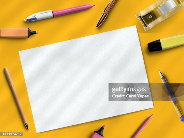 empty sheet and school supplies in yellow - blank book on desk stock pictures, royalty-free photos & images