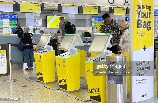 Customers check in for a Spirit Airlines flight at Oakland International Airport on July 28, 2022 in Oakland, California. JetBlue Airways announced...