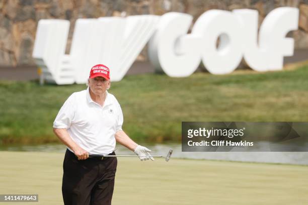 Former U.S. President Donald Trump looks on over the 18th green during the pro-am prior to the LIV Golf Invitational - Bedminster at Trump National...
