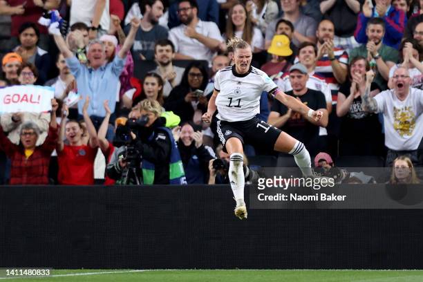 Alexandra Popp of Germany celebrates after scoring her sides 1st goal during the UEFA Women's Euro England 2022 Semi Final match between Germany and...