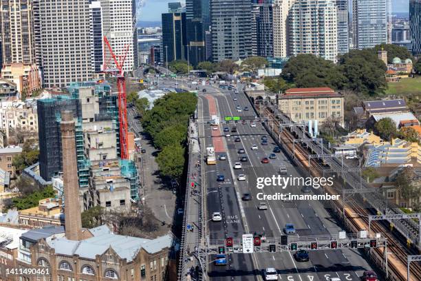 aerial view of busy cahill expy and city of sydney - driving car australia road copy space sunlight travel destinations colour image day getting stock pictures, royalty-free photos & images