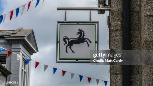 The logo of Lloyds Bank is displayed on the outside of a branch of the bank Lloyds Bank on May 31, 2022 in Penzance, England. Founded in Birmingham...