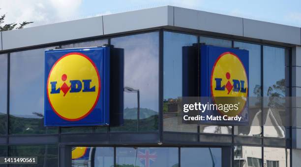 The Lidl logo is displayed outside a branch of the supermarket retailer Lidl on May 31, 2022 in Penzance, England. The German discount retailer chain...