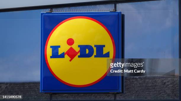 The Lidl logo is displayed outside a branch of the supermarket retailer Lidl on May 31, 2022 in Penzance, England. The German discount retailer chain...
