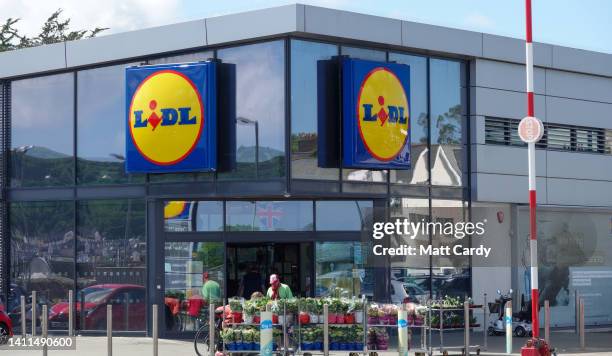 The Lidl logo is displayed outside a branch of the supermarket retailer Lidl on May 31, 2022 in Penzance, England. The German discount retailer chain...