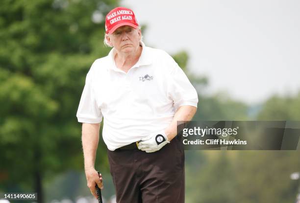 Former U.S. President Donald Trump reacts to a putt on the 15th green during the pro-am prior to the LIV Golf Invitational - Bedminster at Trump...
