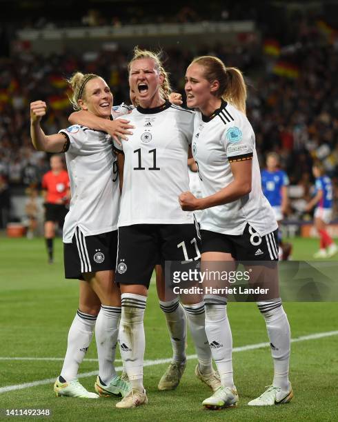 Alexandra Popp of Germany celebrates with teammates Svenja Huth and Sydney Lohmann after scoring her team's second goal during the UEFA Women's Euro...