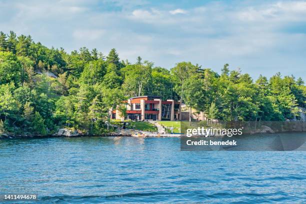 waterfront mansion cottage thousand islands ontario canada - promenade stock pictures, royalty-free photos & images