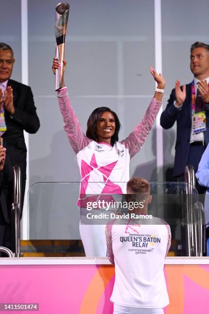 Denise Lewis lifts the Queen’s Baton during the Opening Ceremony of the Birmingham 2022 Commonwealth Games at Alexander Stadium on July 28, 2022 on...