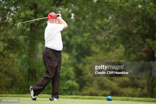 Former U.S. President Donald Trump plays his shot from the 14th tee during the pro-am prior to the LIV Golf Invitational - Bedminster at Trump...